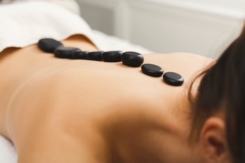 Lady receiving a Hot Stone Massage in Stockton, CA